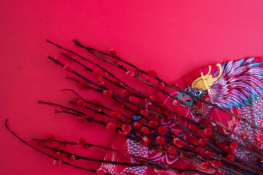 Red Pussy Willow Flowers on Painted Dragon paper Fan on red Background