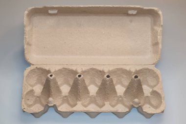 Empty paper carton box for eggs on white background, eco friendly or green product.