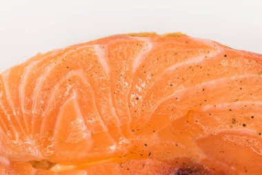 Fresh salted salmon fillet isolated on white background, top view.
