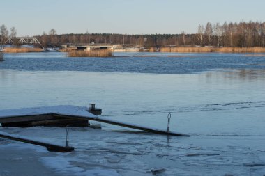 Winter lake. Snowy cold winter. Ice drift. Spring is coming. Winter inspiration. Riga Jugla, Latvia