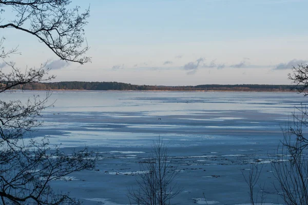 Winter lake. Snowy cold winter. Ice drift. Spring is coming. Winter inspiration. Riga Jugla, Latvia