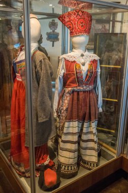 KURESSAARE, ESTONIA - 11 July, 2024: museum exhibits. Estonian national clothes in hall of Kuressaare Castle, Saaremaa. clipart