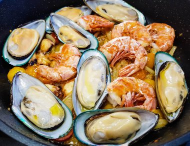 italian seafood pulpo and shells with pasta