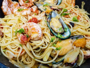 italian seafood pulpo and shells with pasta