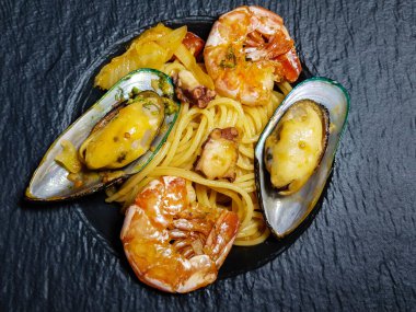 italian seafood pulpo and shells with pasta