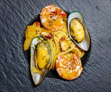 italian seafood pulpo and shells with pasta