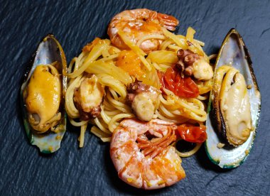 italian seafood pulpo and shells with pasta