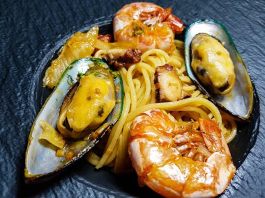italian seafood pulpo and shells with pasta