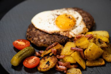 Hacksteak a la Meier Beefsteak with  fried eggs and roasted potatoes