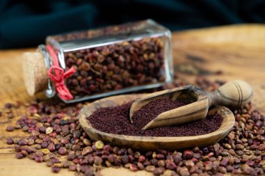 red Turkish Sumach rhus coriaria on olive wood