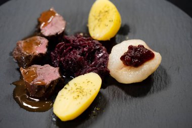 saddle of venison with herbs and spices