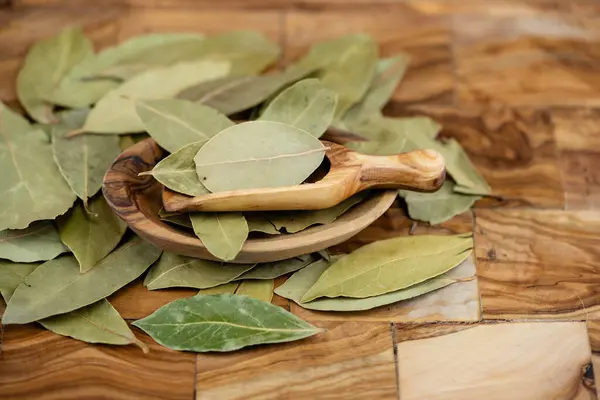 Bay leaves and on olive wood