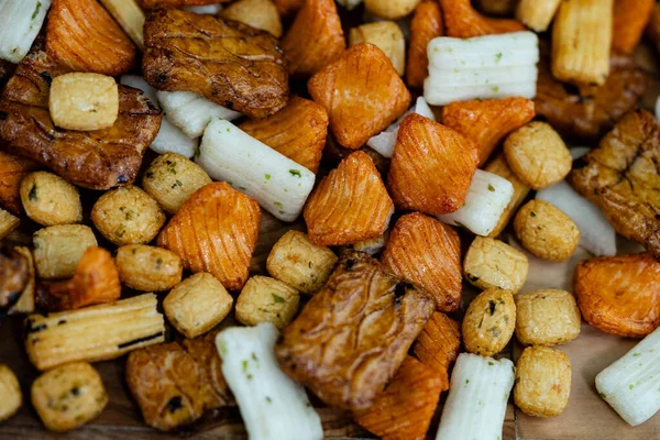 stock image Different types of Japanese rice cakes on olive wood