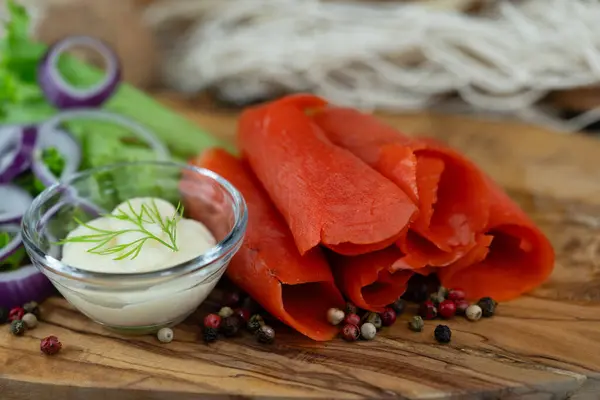 Stock image smoked Salmon herbs and spices on olive wood