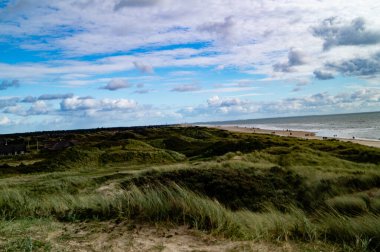 Impressions of the endless beach at the northern sea in Blavand Denmark clipart