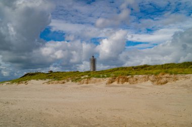 Impressions of the endless beach at the northern sea in Blavand Denmark clipart