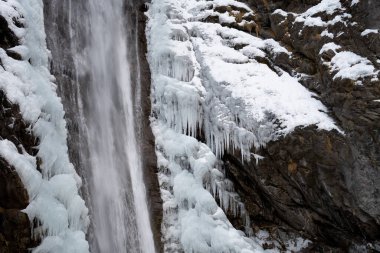 Shot at the frozen waterfall with snow and chunks of ice as a side dish. Candid white