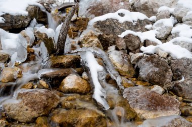 Shot at the frozen waterfall with snow and chunks of ice as a side dish. Candid white