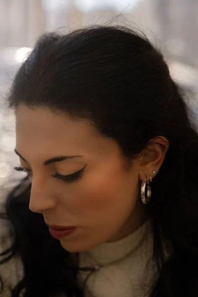 Caucasian white woman with black hair. Closeup portrait, without glasses
