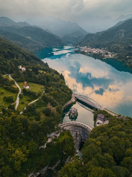 stock image Aerial shot of Barcis lake and its dam. Emerald water, sky with clouds