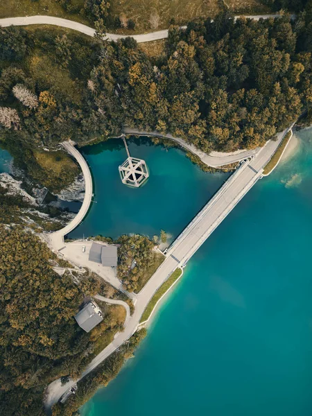 stock image Aerial shot of Barcis lake and its dam. Emerald water, sky with clouds