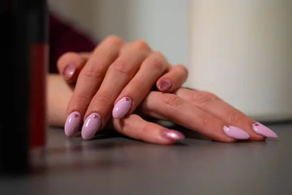 Female hands with nail polish, healing and aesthetic manicure