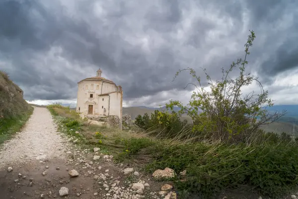 stock image Rocca Calascio at sunset with cold light and threatening clouds