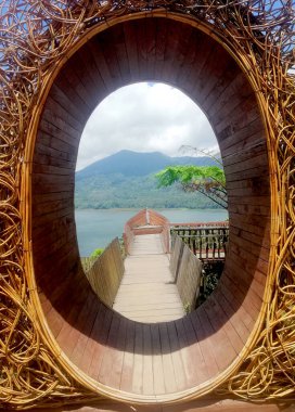 View of Wanagiri Hill at Buleleng regency of Bali, on rattan decoration frame clipart