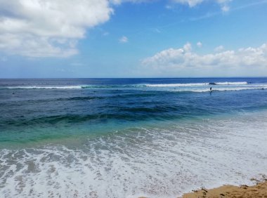 Bali,Indonesia - October 19th 2024 : Dream Land Beach, at Uluwatu area, with beautiful rock formation, during nice weather.One of the famous destination on the island clipart