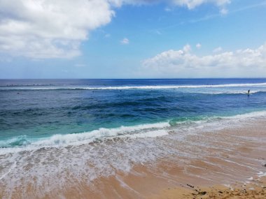 Bali,Indonesia - October 19th 2024 : Dream Land Beach, at Uluwatu area, with beautiful rock formation, during nice weather.One of the famous destination on the island clipart