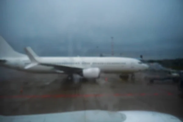 Blurred Photo White Plane Cloudy Weather Riga Airport High Quality — Stock Photo, Image