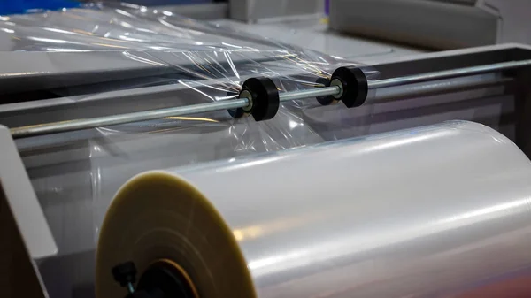 Conveyor Belt For Packaging In Transparent Polythene Stretch. Concept Of Industrial Technologies And Packaging Materials. High quality photo