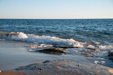 Close Up Sandy Beach And Sea Waves Of Ionian Sea On Sunset, Kounoula Beach, Corfu, Greece. High quality photo