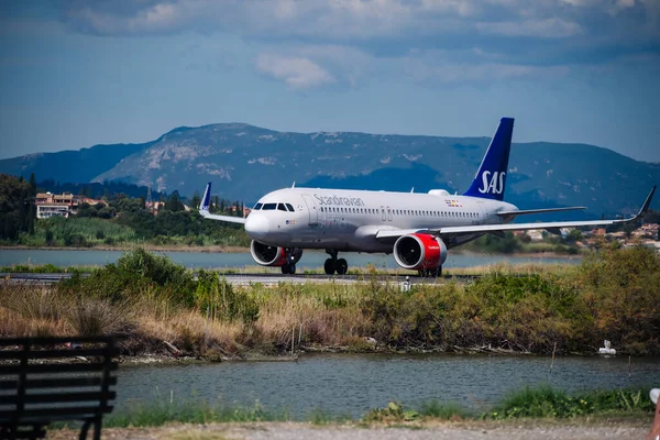 stock image Kerkyra, Greece - 09 24 2022: Corfu Airport, SAS Scandinavian Airlines Plane Prepares To Take Off From Shortest Landing Runway. High quality photo