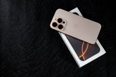 Jurmala, Latvia - 31.05.2025: Apple Iphone 16 Pro Desert Titanium with box. High quality photo