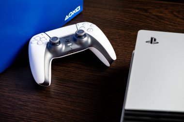 Jurmala, Latvia - 02.06.2025: New Games console Sony PlayStation 5 Pro and Game Controller Sony Playstation 5 DualSense. Latest Gaming Console From Sony Features Advanced Design. High quality photo