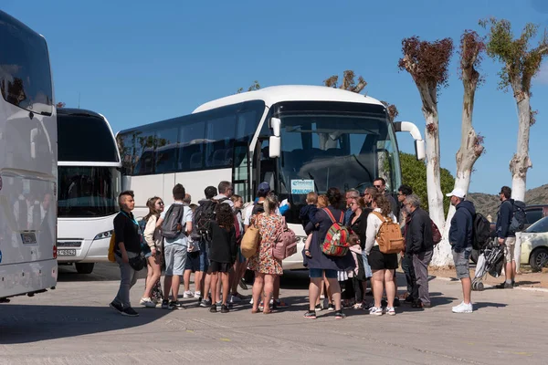 Stock image Elounda, Crete, Greece. 2023. Travellers wait to board their tour bus at the coach station in Elounda a popular coastal resrt in Crete