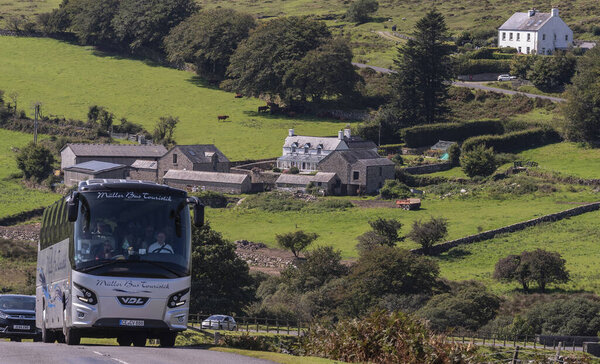 Dartmoor national park, Devon, England, UK. 4th September 2023. German tour bus travelling in Dartmoor national park, Devon, England, UK.