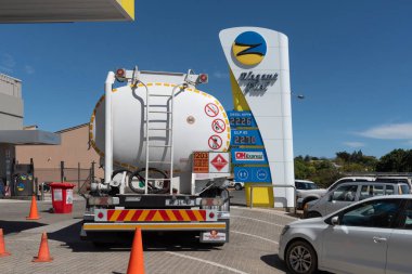 Tulbagh, Western Cape, South Africa. 28 February 2024.  Large fuel tanker delivering fuel to a service station in Tulbach, Western Cape, South Africa. clipart