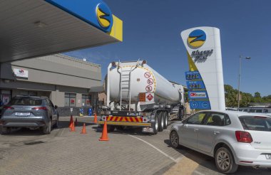 Tulbagh, Western Cape, South Africa. 28 February 2024.  Large fuel tanker delivering fuel to a service station in Tulbach, Western Cape, South Africa. clipart