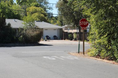 Intersection with Stop sign. Photo on a sunny day clipart