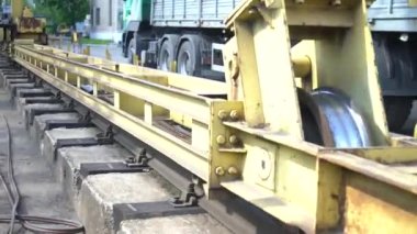 movement of the gantry crane on the rails in the production of heavy industry. Transportation of metal products in the ironworks