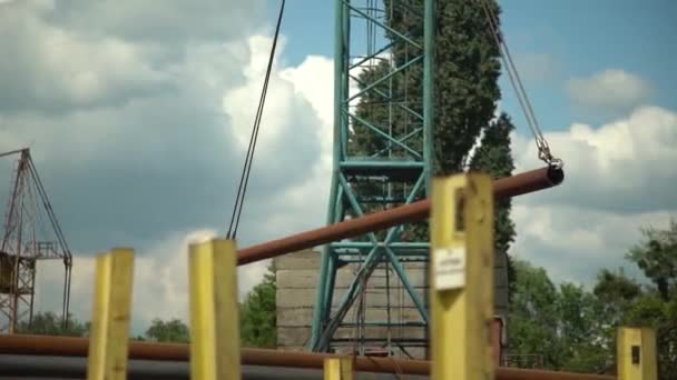 Gantry Crane Moves Large Pipes Steel Mill Open Air Warehouse — Video Stock