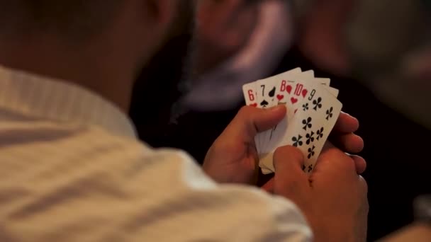 Man Poker Table White Shirt Opens Cards Plays Poker Cards — 图库视频影像