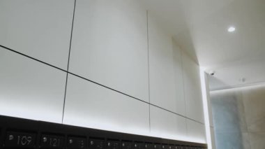  Modern kitchen with a gray metal facade. Close-up gray and black kitchen interior. a small lamp on the ceiling dolly shot, slow motion. High quality 4k footage