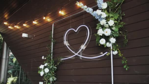 Iluminated Neon Heart Decoration Hanging Wooden Wall Floristic Composition Wedding — Stock video