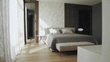 Geniş yataklı bir yatak odası ve rahat mobilyalarla dolu bir bank. Hepsi de güzel ahşaptan yapılmış. Evde samimi ve davetkar bir atmosfer yaratıyor.