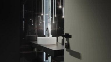 Bu şık ve modern banyo gösterişli bir lavabo, çağdaş aydınlatma ve güzel temiz hatlar içeriyor.