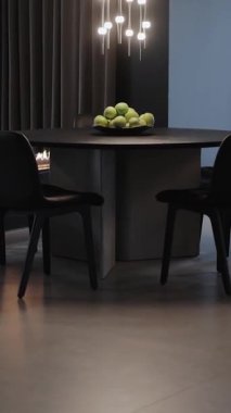  Dikey ekran: Yeşil elmalı yuvarlak masalı bir yemek alanı, modern iç tasarım estetiği için mükemmel.