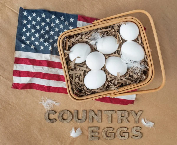 Basket of White Country Eggs with American Flag on Brown